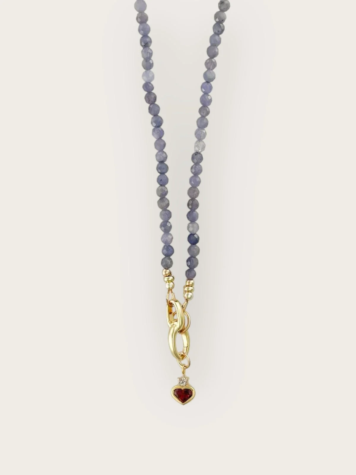 Ordoñez Le Rosalind Strand necklace with purple beads and a red heart charm, from the official brand website