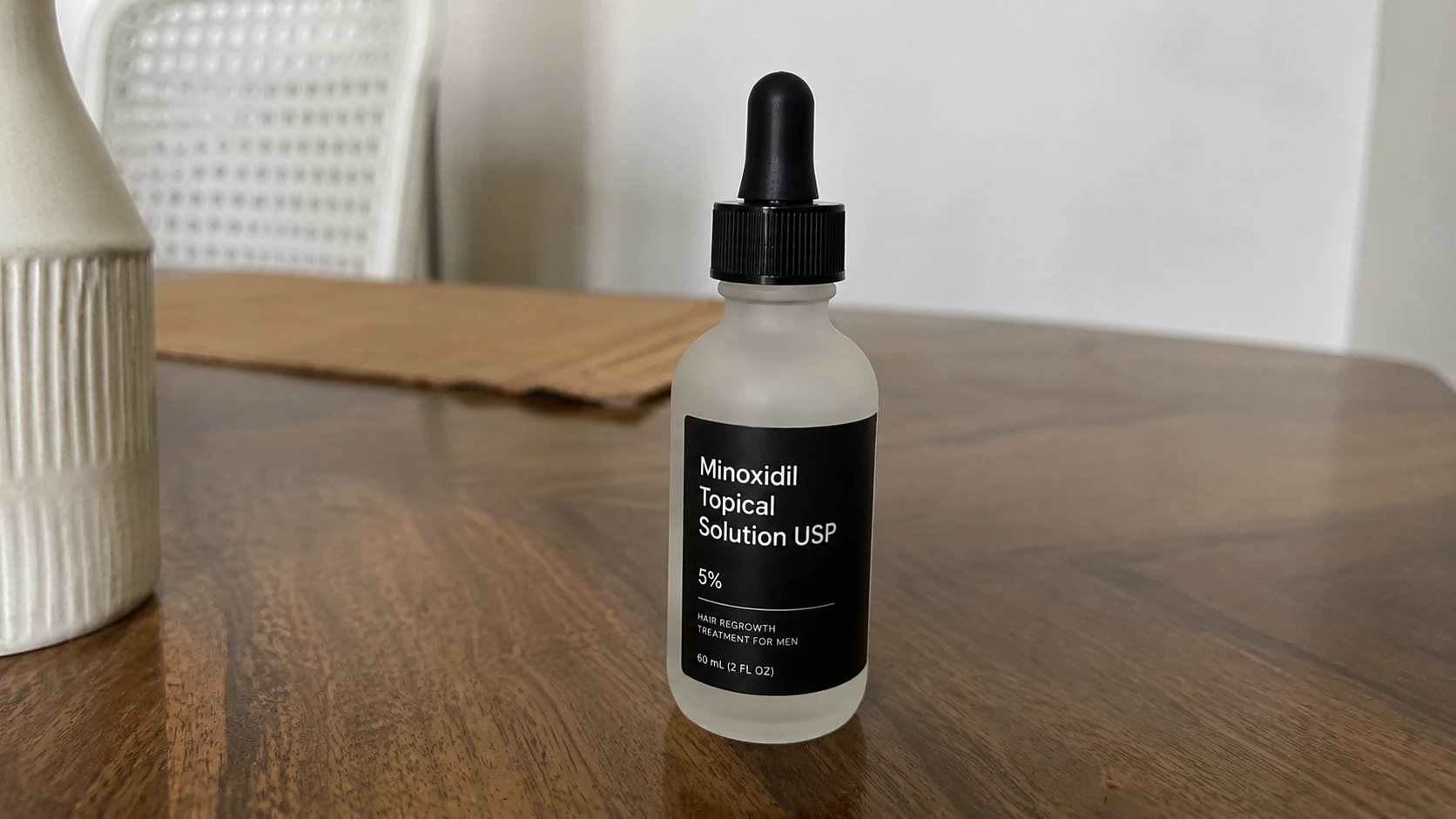 Raw tabletop photo of scalp oil bottle