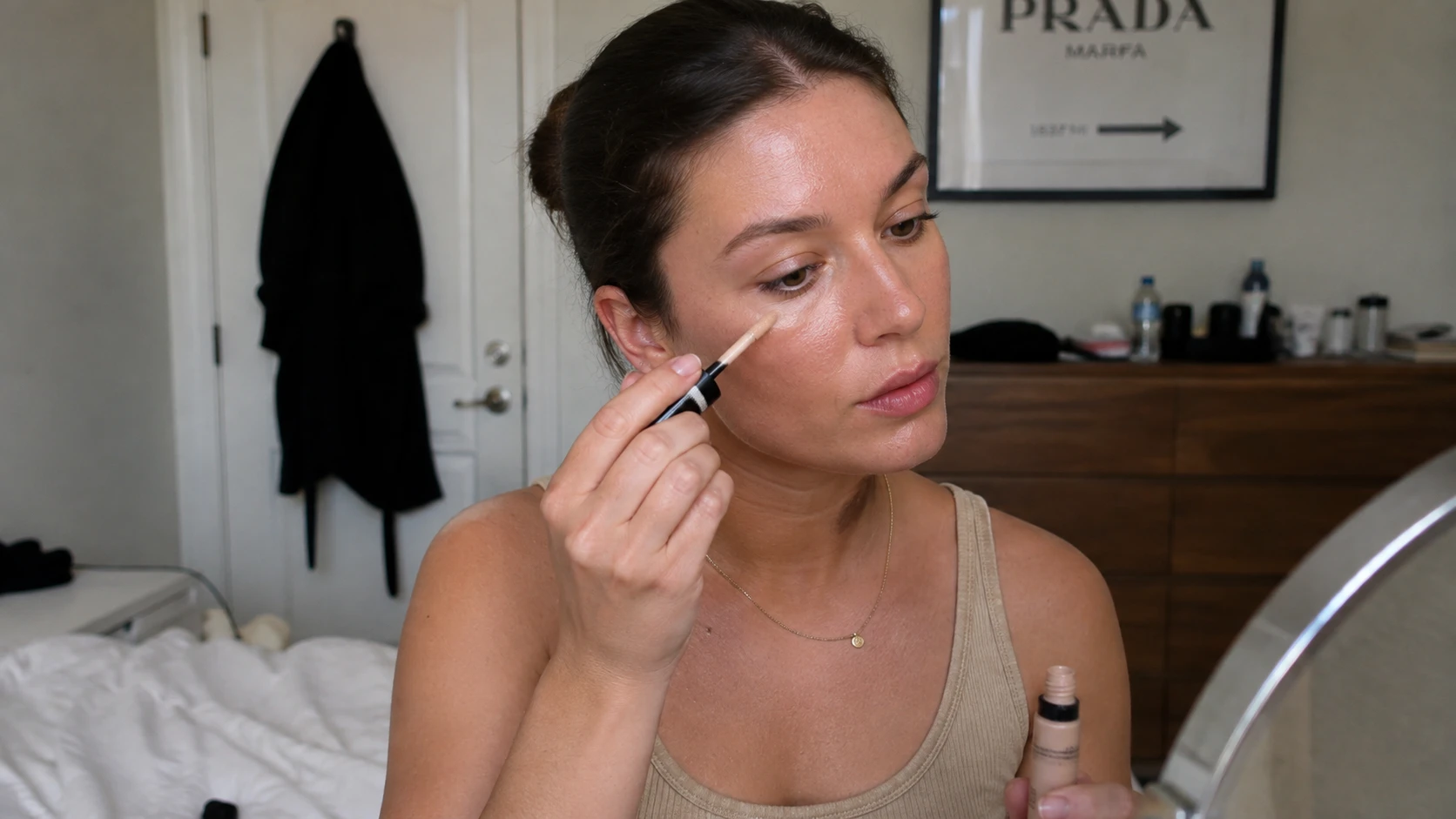 AI cosmetics makeup photoshoot: Beauty model applying liquid concealer with natural studio lighting